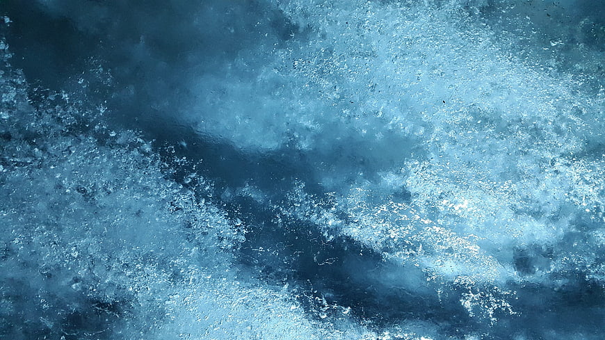 Abstract Blue Ice Texture with Frozen Bubbles and Crystalline Structure