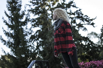Blonde Woman in Red Plaid Shirt Standing Outdoors