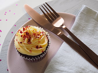 Chocolate Cupcake with Yellow Frosting and Rose Gold Cutlery