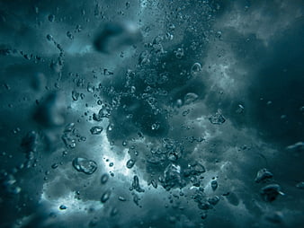 Abstract underwater bubbles in deep blue water
