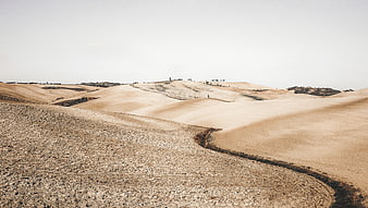 Rolling Arid Hills and Dry Landscape with Sparse Vegetation