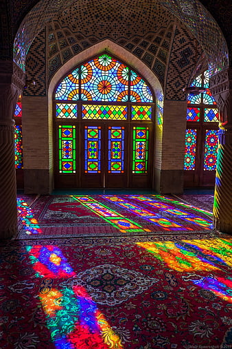 Colorful Stained Glass Light Patterns on Persian Carpet in Nasir al Mulk Mosque