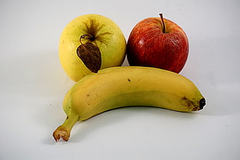 Fresh Banana and Apples on White Background