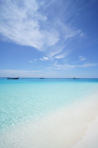 Tropical Beach with Turquoise Water and Boats