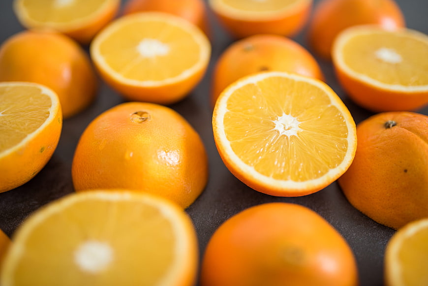 Fresh Sliced Oranges on Dark Background