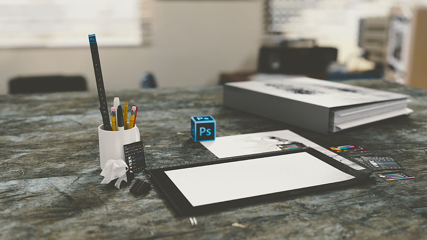 Graphic Designer Workspace with Digital Drawing Tablet and Tools