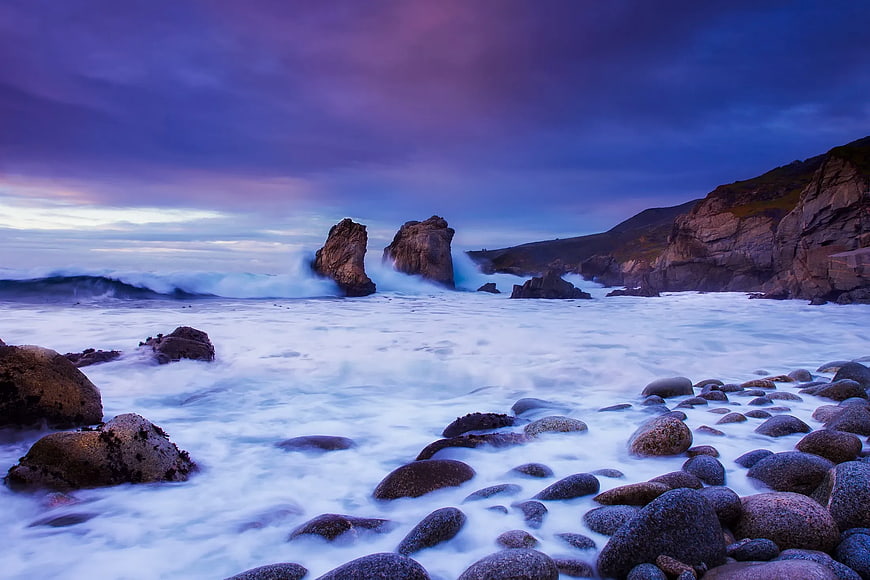 Dramatic coastal seascape with sea stacks at blue hour