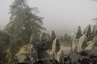 Foggy view from stone castle ramparts in Portugal