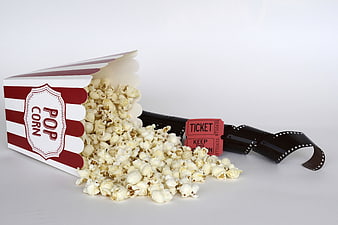 Spilled Popcorn Box with Movie Ticket and Film Strip