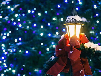 Christmas Lantern with Red Bow and Snowy Background