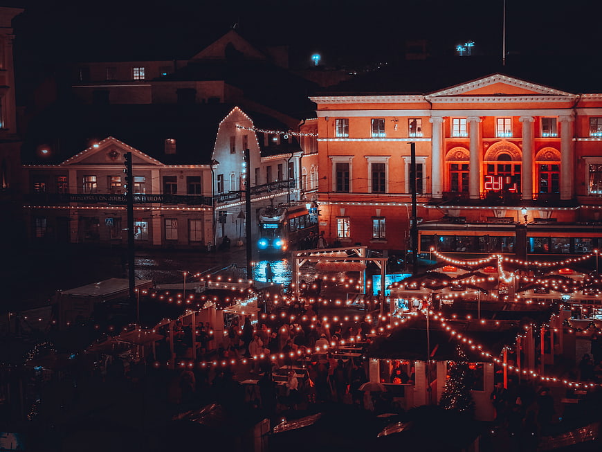 Night view of festive Christmas market in European city square