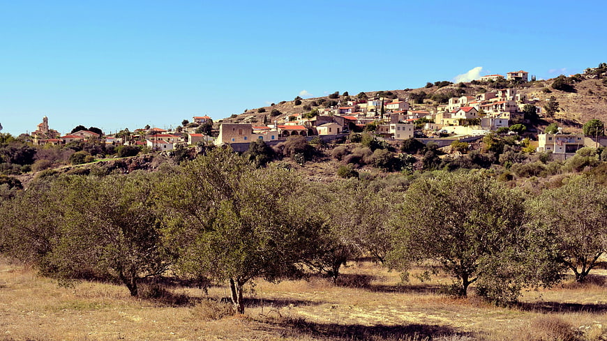 Traditional Mediterranean village on a hill with olive groves