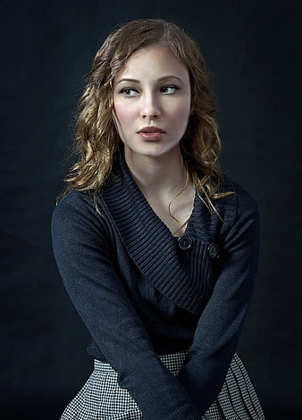 Studio Portrait of Young Woman in Dark Knit Cardigan