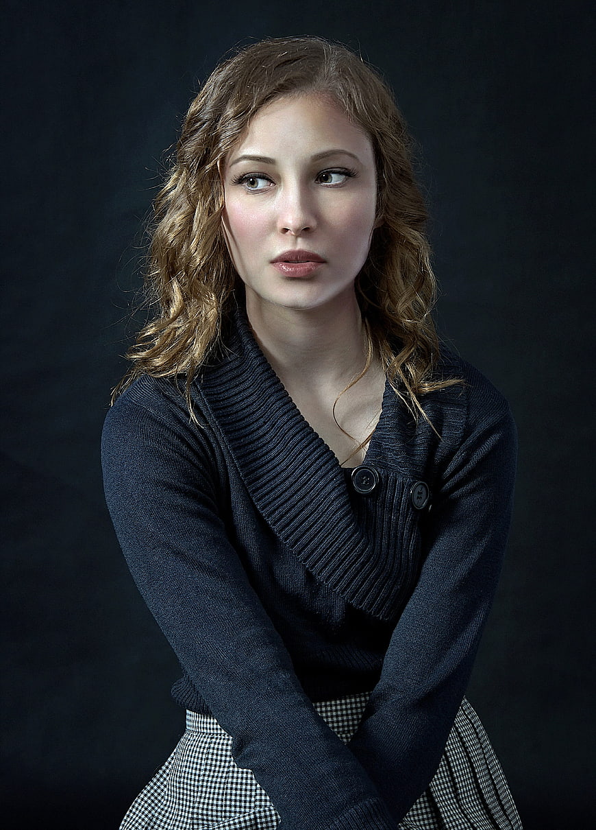 Studio Portrait of Young Woman in Dark Knit Cardigan