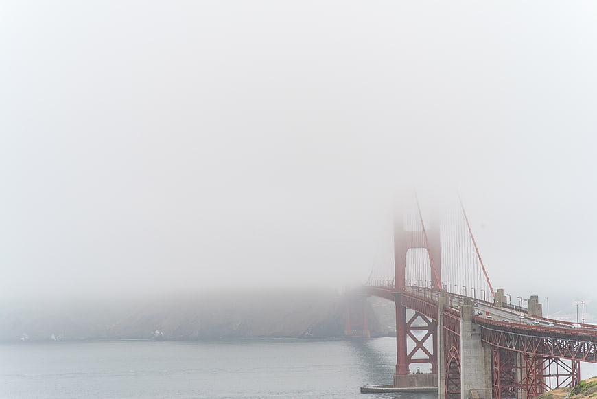 Golden Gate Bridge partially obscured by thick fog