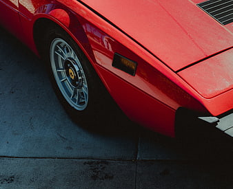 Close-up of Classic Red Sports Car Wheel and Body