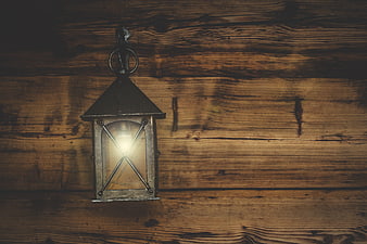 Vintage Lantern Hanging on Rustic Wooden Wall
