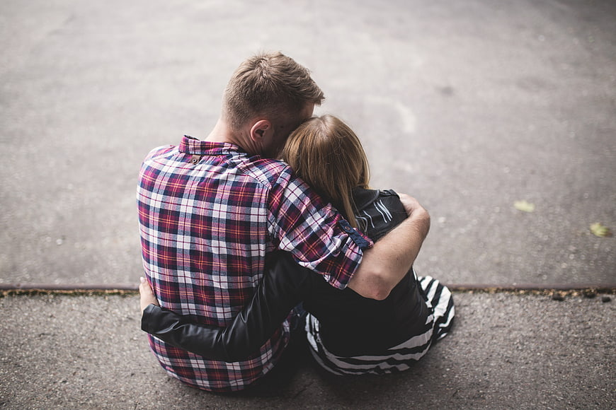 Couple Hugging on Pavement from High Angle