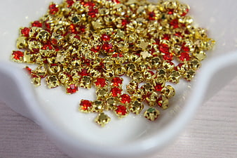 Red and Gold Rhinestones in White Dish
