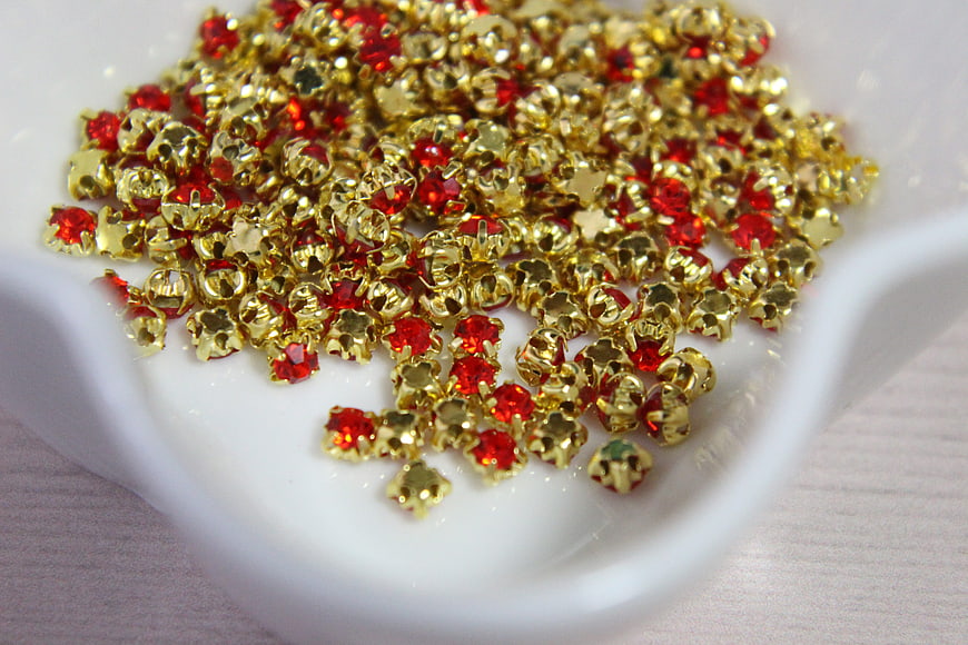 Red and Gold Rhinestones in White Dish