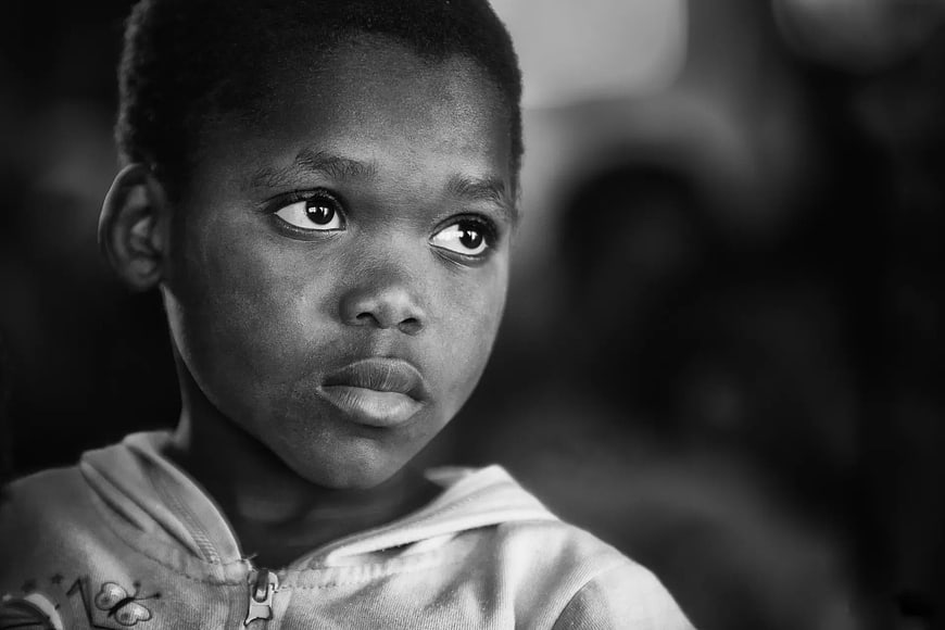 Black and White Portrait of Young Boy Looking Away