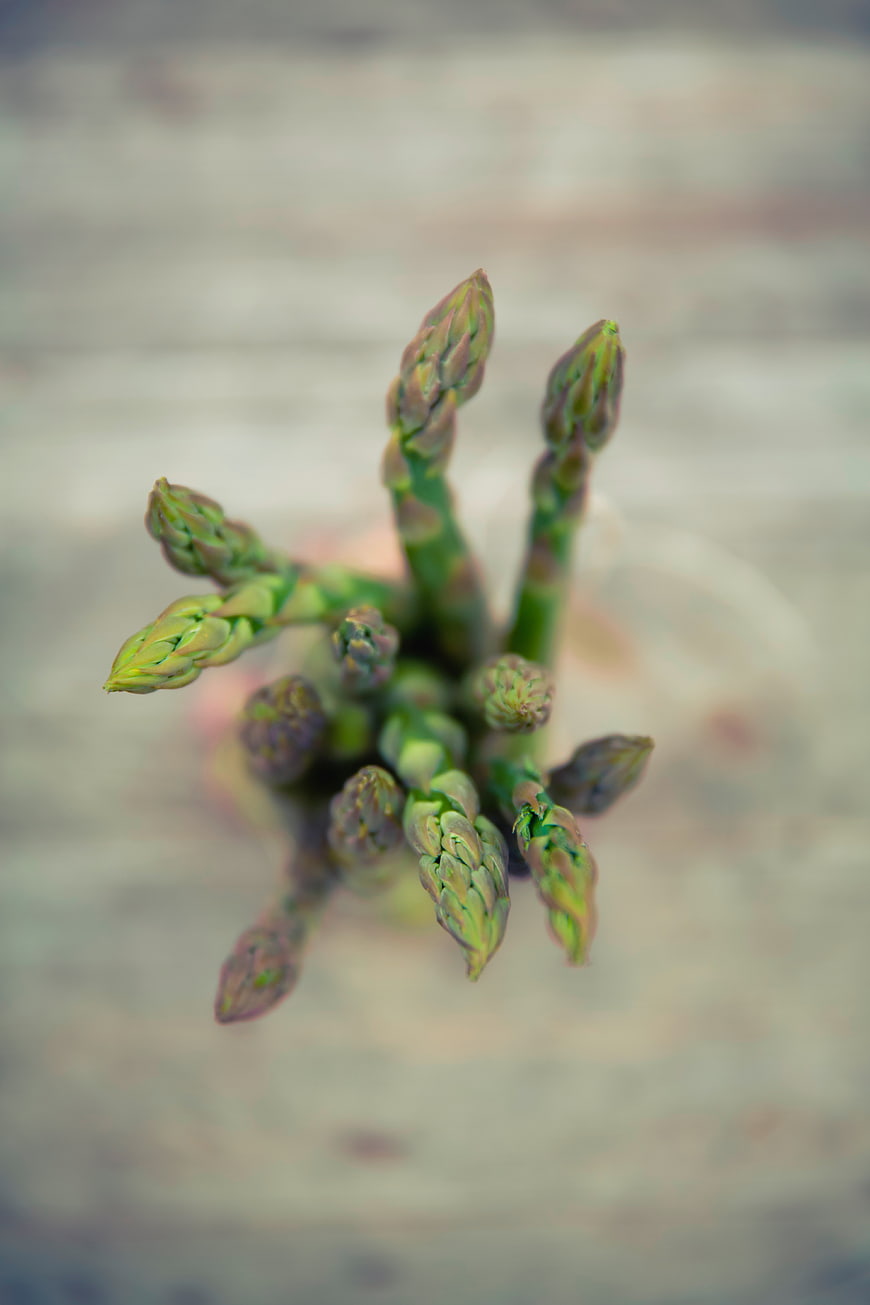 Top View of Fresh Green Asparagus Spears on Wooden Background