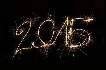 Sparkler light painting writing 2015 on black background