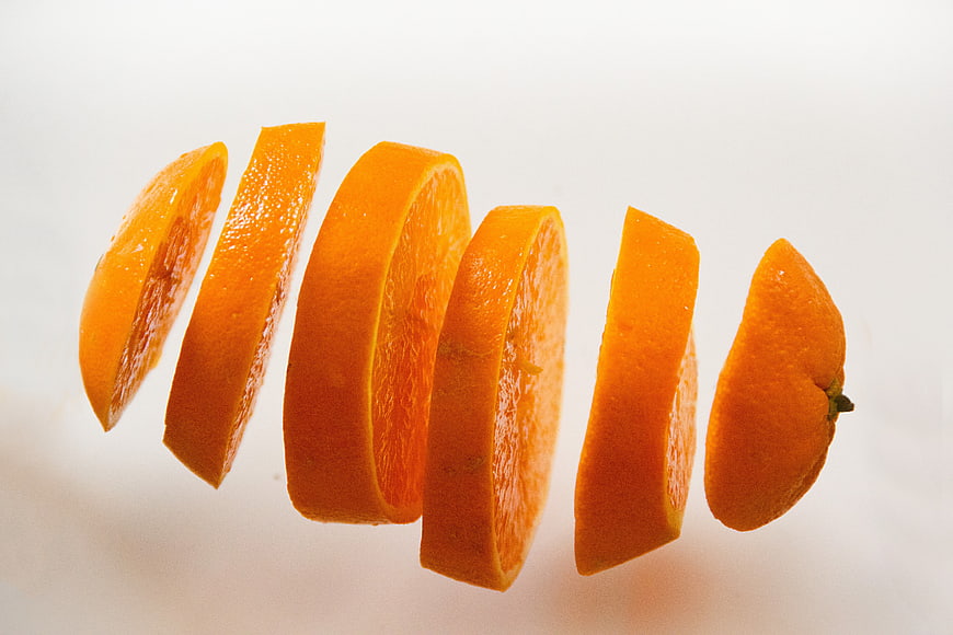 Sliced Orange Floating in White Background Fresh Fruit