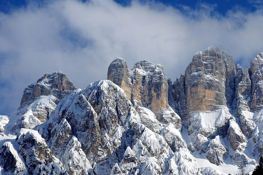 Snowy Dolomites Mountain Peaks Under Blue Sky