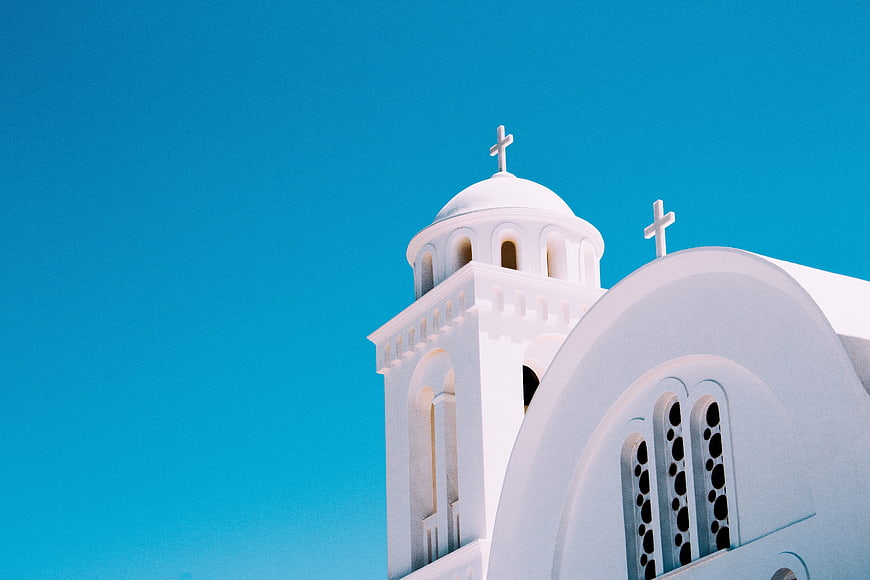 White Greek Orthodox Church Against Blue Sky