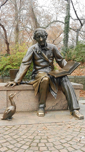 Bronze Statue of Man Reading with Duck in Park
