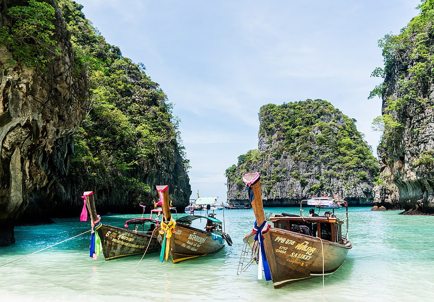 Traditional Thai Longtail Boats in Turquoise Lagoon
