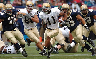 American Football Player Running with Ball During Game