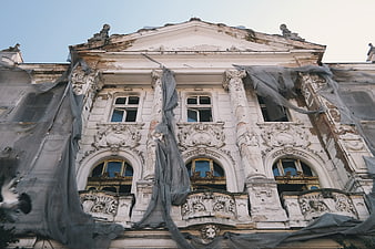 Decaying Baroque Mansion with Tattered Construction Netting