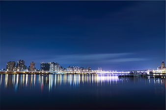 Night City Skyline with Reflections on Water