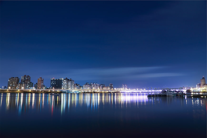 Night City Skyline with Reflections on Water