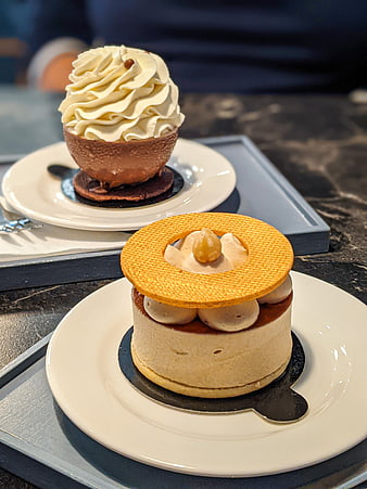 Elegant individual desserts with cream and biscuit topping