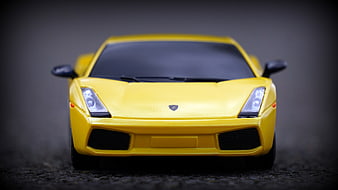 Yellow Lamborghini Model Car on Asphalt