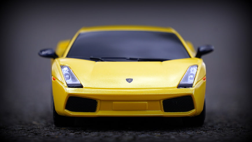 Yellow Lamborghini Model Car on Asphalt