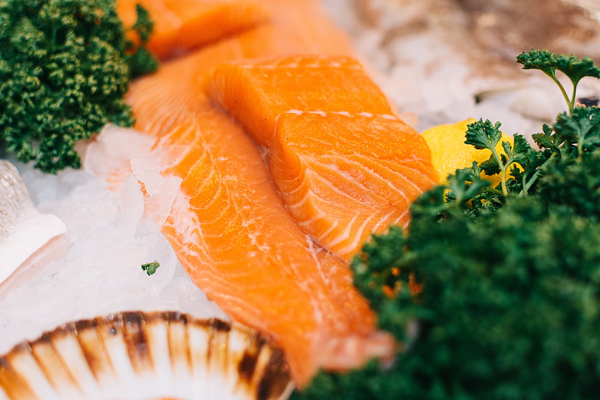 Fresh Salmon Fillet on Ice with Parsley and Lemon