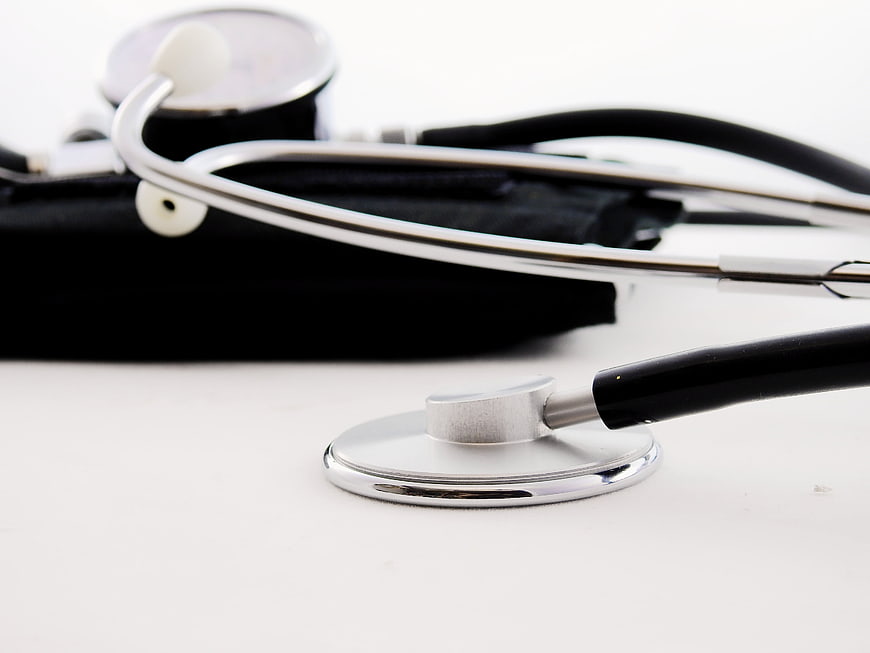 Close-up of stethoscope and blood pressure cuff on white background