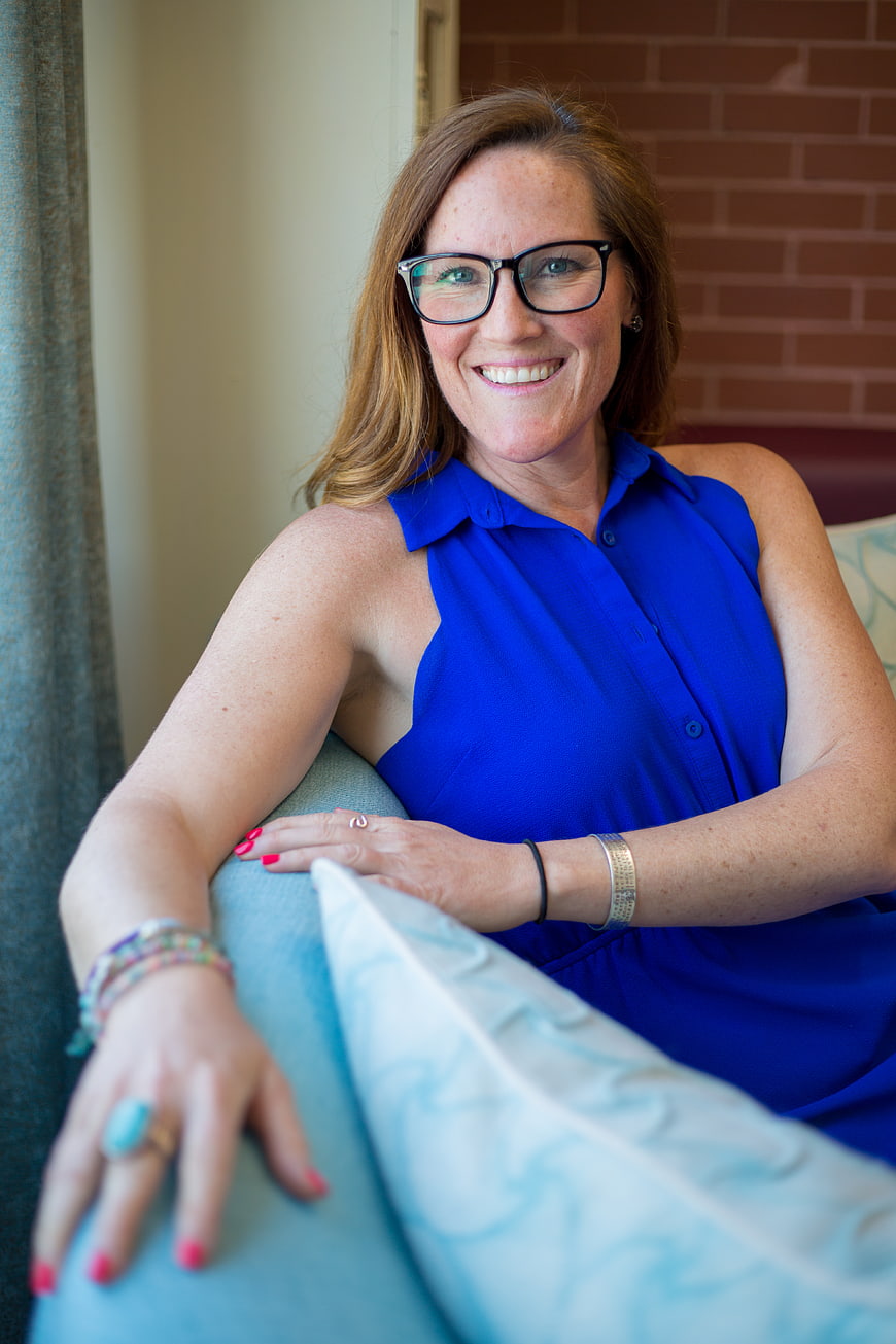 Smiling Business Woman in Blue Dress with Glasses