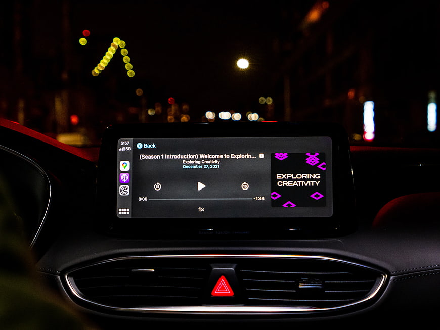 Podcast Playing on Car Infotainment Screen at Night