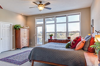 Bright Modern Bedroom Interior With Large Windows And Mountain View