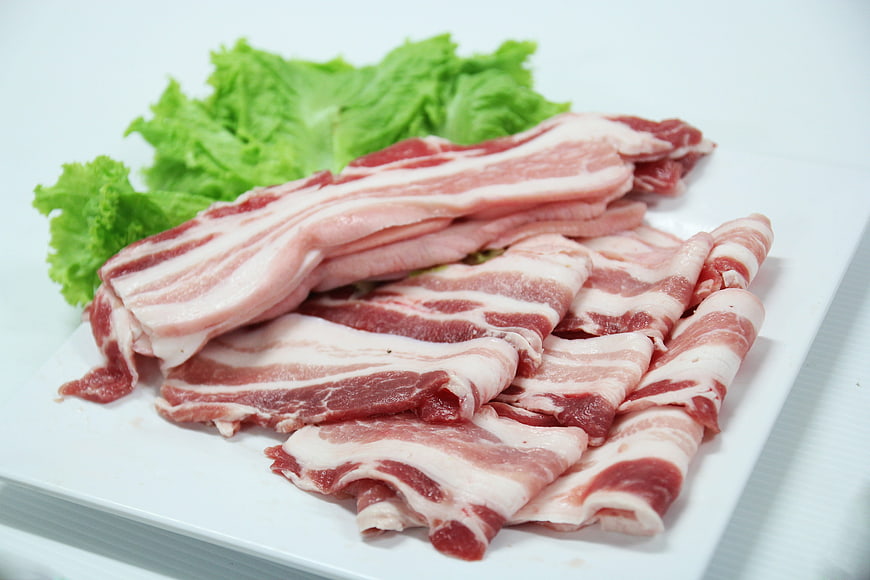 Fresh Raw Pork Belly Slices With Lettuce On White Plate