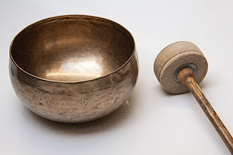 Antique Brass Singing Bowl With Wooden Mallet On White Background