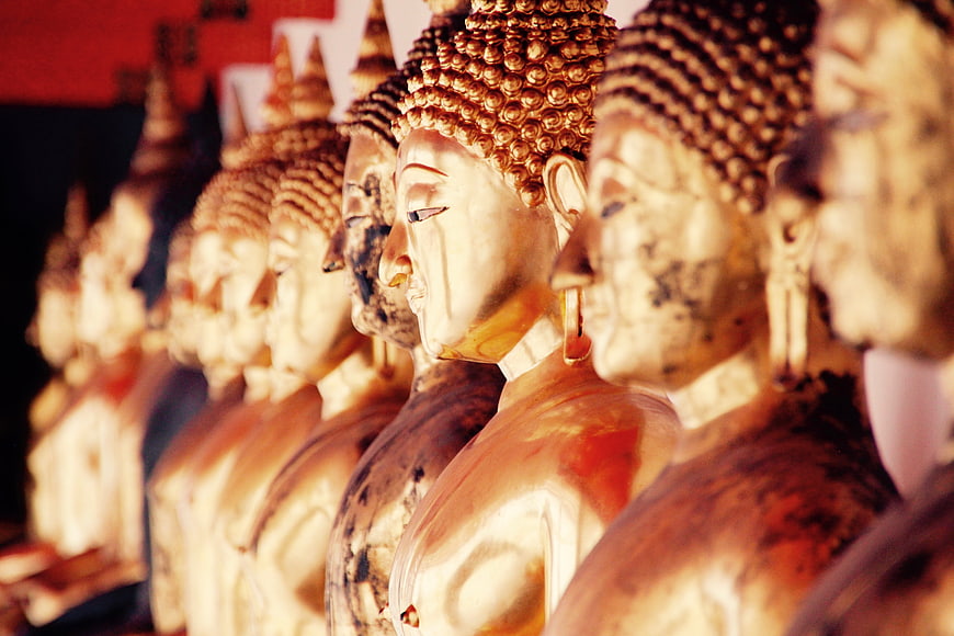 Row of Golden Buddha Statues in Thai Temple