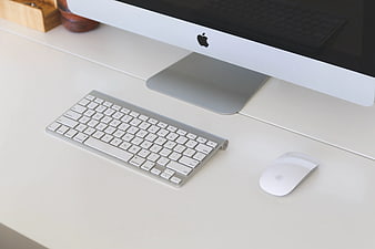 Minimalist Apple iMac Workspace on White Desk