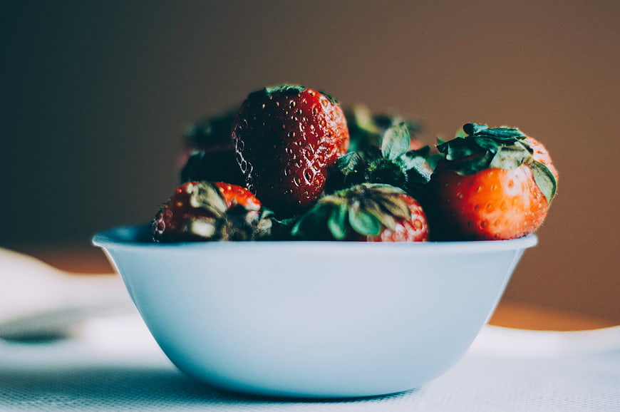 Fresh Strawberries in a White Bowl on a Table