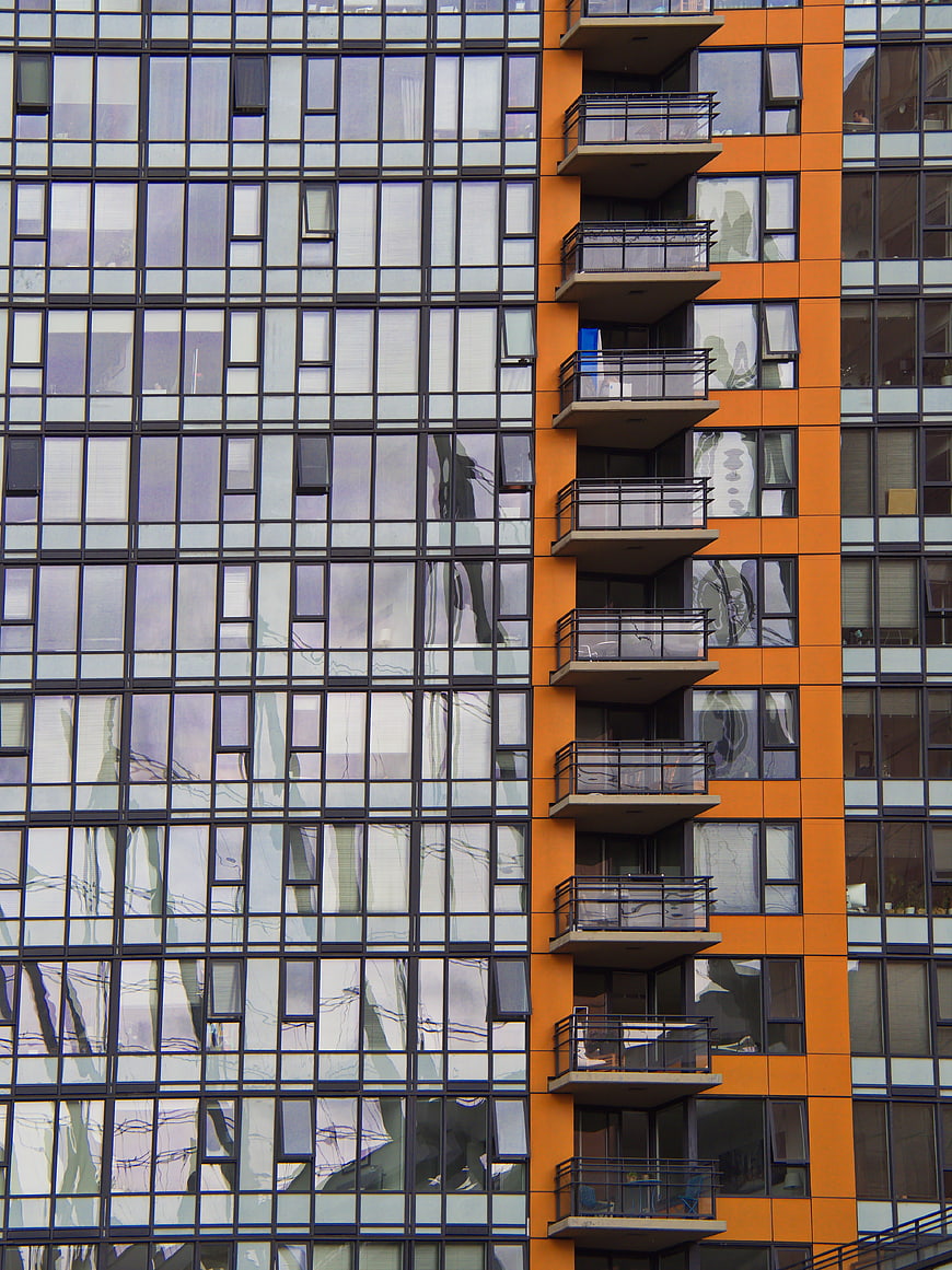 Modern Orange and Glass Apartment Building Facade